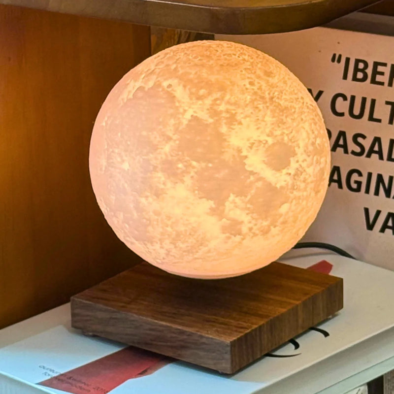 Lunara Moon Lamp warm glow on bookshelf
